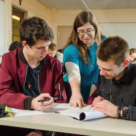 Professor helping students
