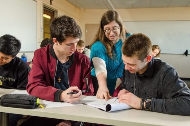 Professor helping students